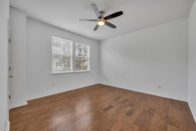 empty room featuring dark hardwood / wood-style floors and ceiling fan