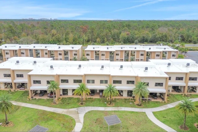 drone / aerial view with a view of trees