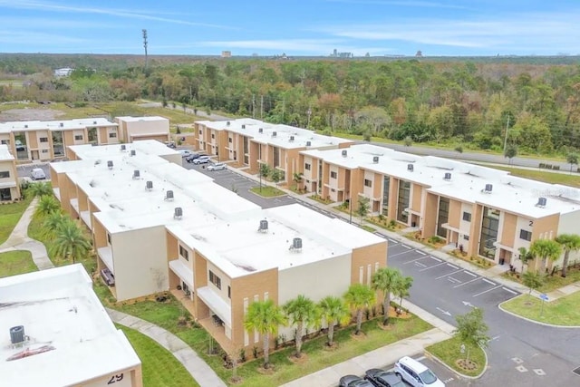 drone / aerial view with a view of trees