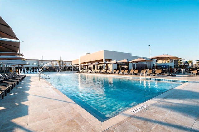 view of pool with pool water feature