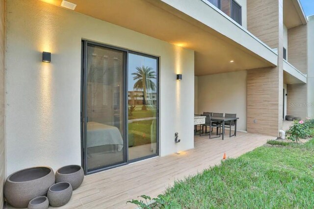 wooden terrace featuring a patio area