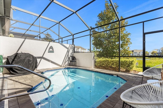 view of pool with a lanai and a patio area