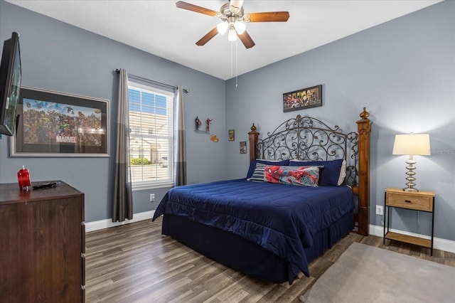 bedroom featuring ceiling fan and dark wood-type flooring