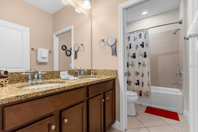 full bathroom featuring tile flooring, shower / bath combo, toilet, and dual bowl vanity