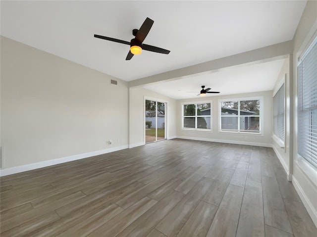 interior space featuring wood-type flooring and ceiling fan