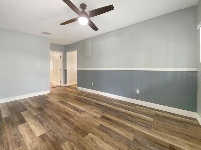 empty room featuring ceiling fan and wood-type flooring