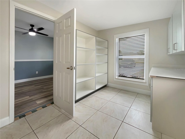 bathroom with wood-type flooring and ceiling fan