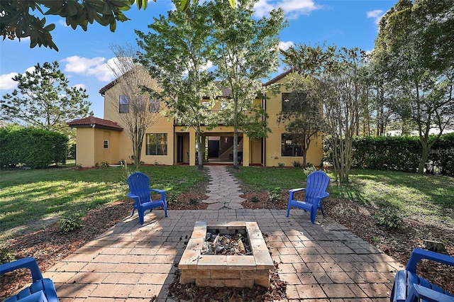 view of patio with a fire pit