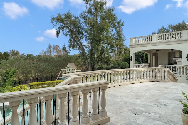 exterior space featuring ceiling fan and a patio