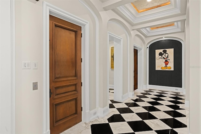 corridor featuring a tray ceiling, crown molding, and light tile flooring