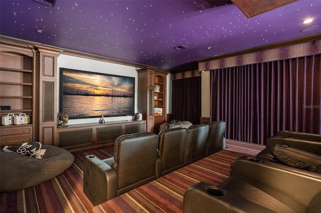 home theater with dark colored carpet and built in features