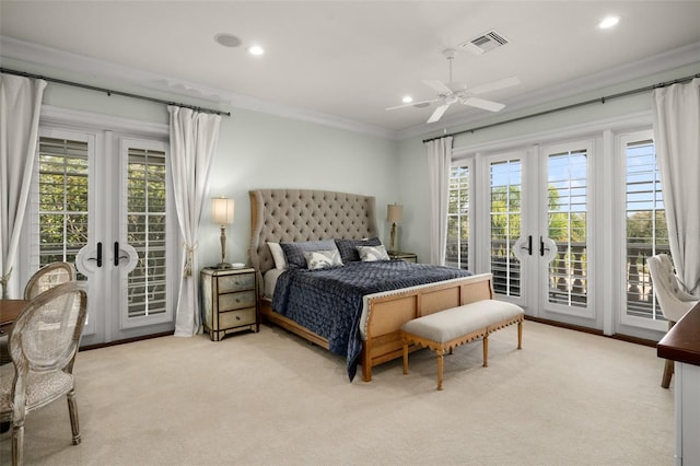 carpeted bedroom featuring french doors, ceiling fan, crown molding, and multiple windows