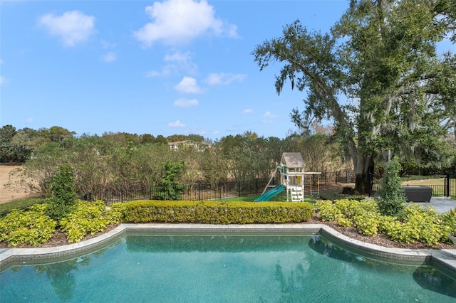 view of pool featuring a playground