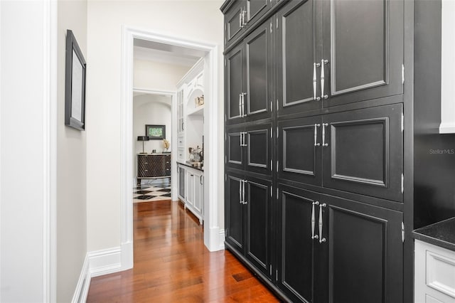 corridor featuring dark hardwood / wood-style flooring