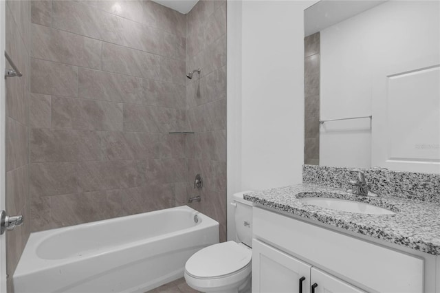 full bathroom featuring vanity, toilet, and tiled shower / bath combo