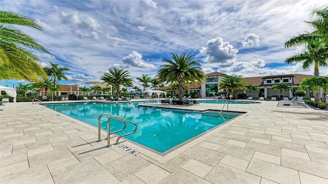 view of swimming pool with a patio