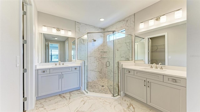 bathroom with plenty of natural light, vanity, and a shower with shower door