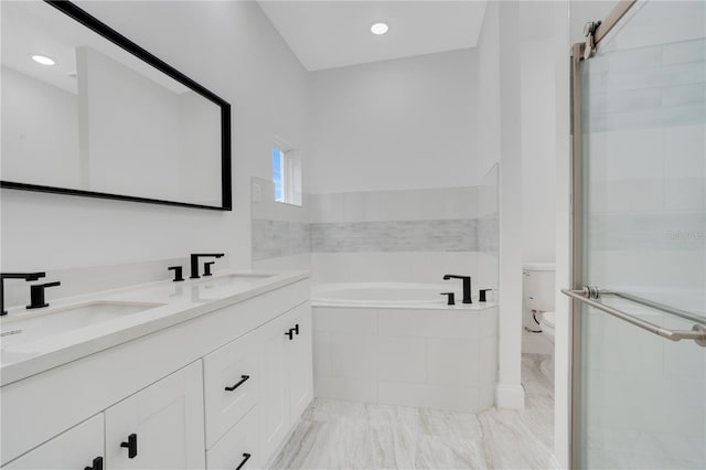 full bathroom with vanity, separate shower and tub, and toilet