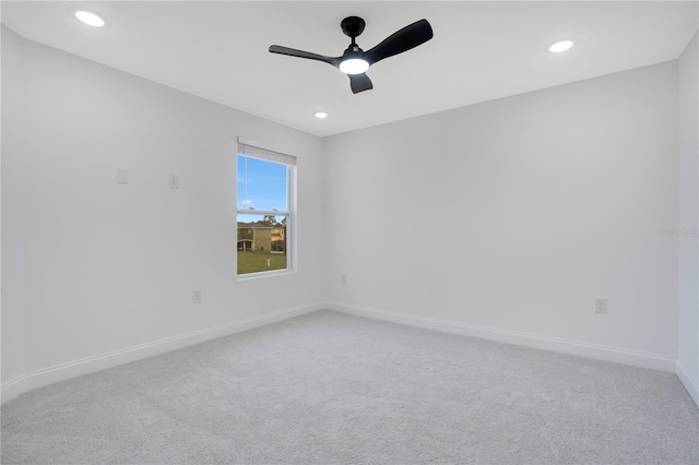 empty room with carpet flooring and ceiling fan