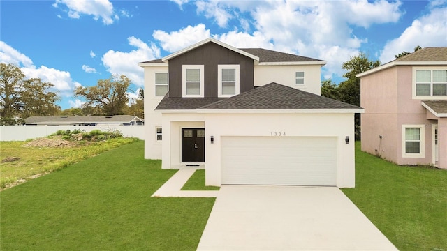 view of front property with a garage and a front lawn