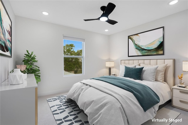 bedroom with light colored carpet and ceiling fan