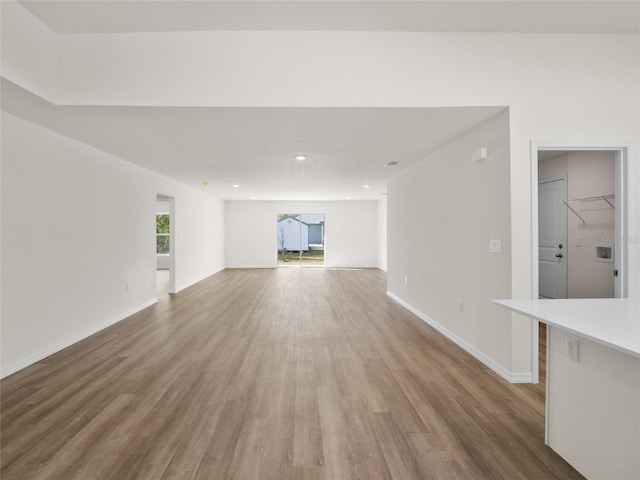 unfurnished living room featuring hardwood / wood-style floors