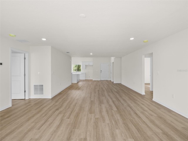 unfurnished living room with light hardwood / wood-style floors