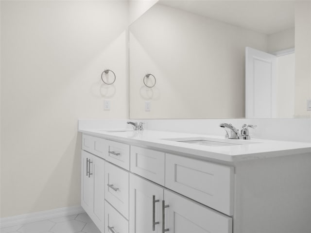 bathroom featuring tile patterned flooring and vanity