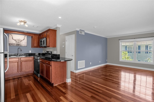 kitchen featuring stainless steel appliances, dark wood-type flooring, and crown molding