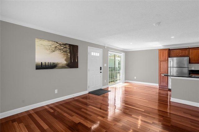 unfurnished room with light hardwood / wood-style floors and ornamental molding