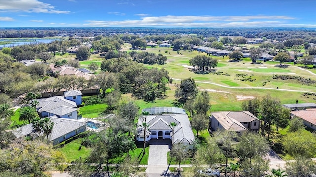 bird's eye view with view of golf course and a water view