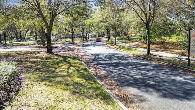 view of road with sidewalks and curbs