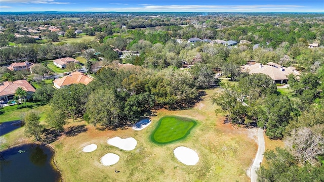 birds eye view of property with a view of trees