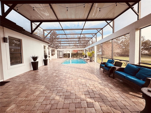 view of pool featuring an outdoor living space, a patio, and glass enclosure