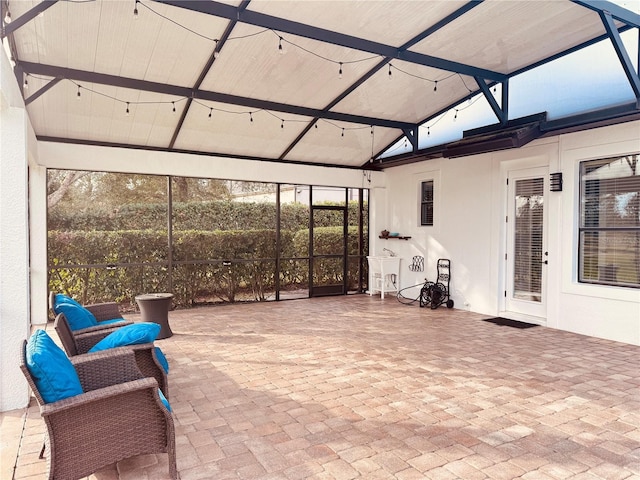 sunroom / solarium featuring a sink