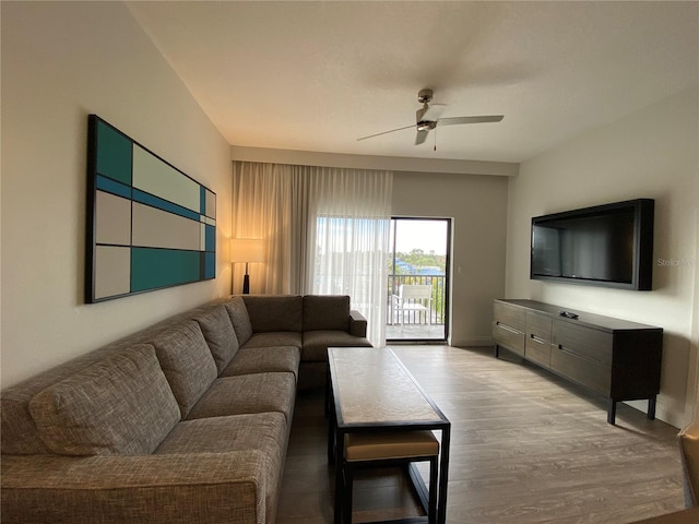 living room with hardwood / wood-style floors and ceiling fan