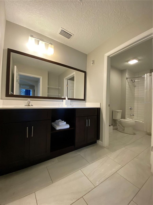 full bathroom featuring toilet, shower / tub combo, tile flooring, a textured ceiling, and vanity