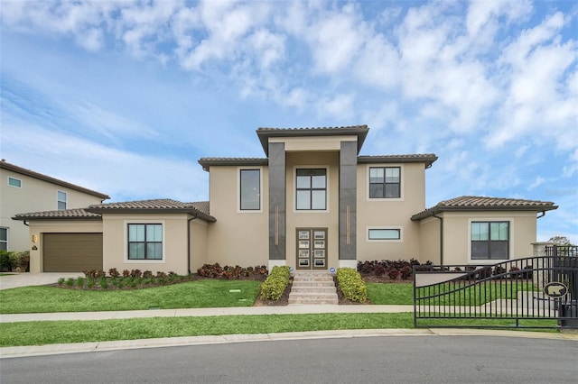 mediterranean / spanish-style house featuring a front lawn and a garage