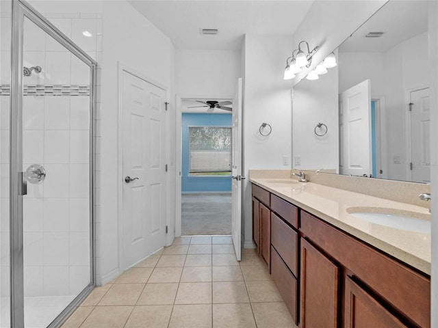 bathroom featuring an enclosed shower, vanity, tile patterned floors, and ceiling fan