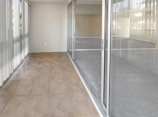 corridor featuring light tile flooring