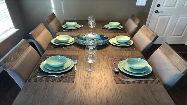 unfurnished dining area with dark hardwood / wood-style flooring