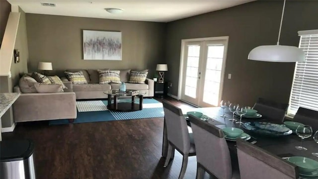 dining area with french doors and dark hardwood / wood-style flooring