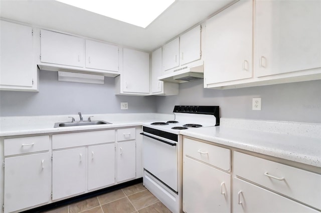 kitchen featuring white cabinets, electric stove, sink, and light tile patterned floors