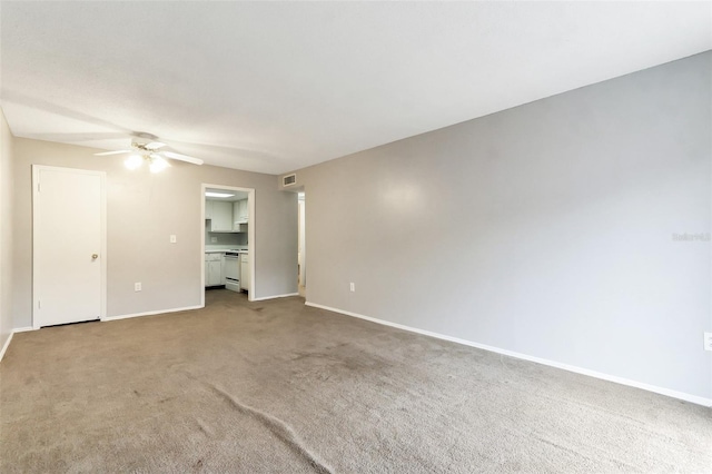 empty room with light carpet and ceiling fan