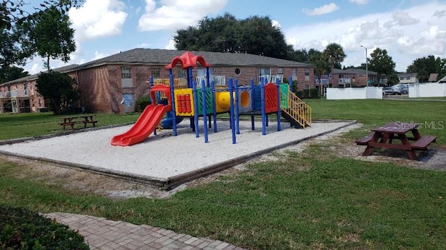 view of playground featuring a yard