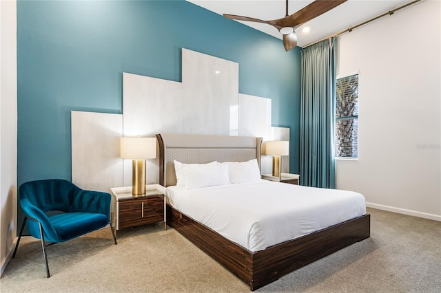 bedroom featuring ceiling fan and light colored carpet