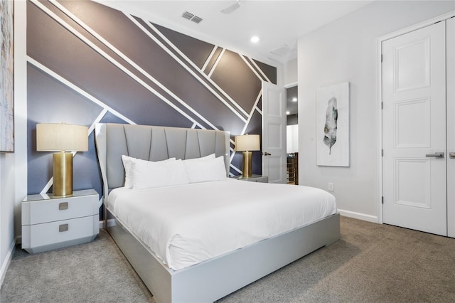 bedroom with light colored carpet and a closet