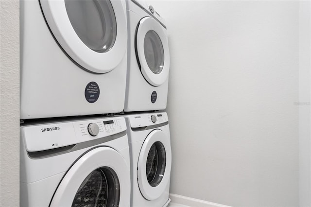 washroom with stacked washer / drying machine