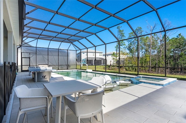 view of pool featuring a lanai, a patio area, and an in ground hot tub