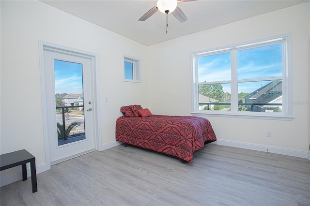 bedroom with ceiling fan and light wood-type flooring